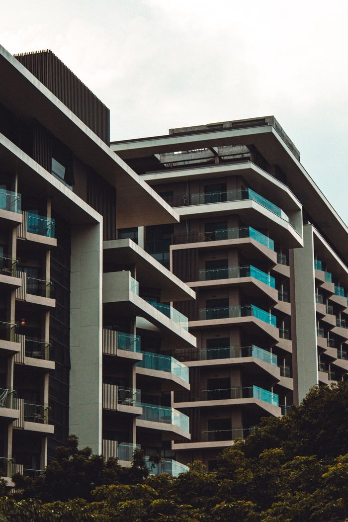 Contemporary residential buildings featuring striking modern architecture with glass balconies.
